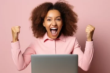 Foto op Canvas Ecstatic young African-American woman celebrating online success © Adobe Contributor