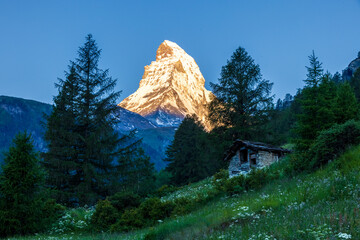 Matterhorn seen from Zermatt at sunrise when the mountain is turning golden