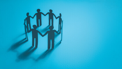 team work show unity and solidarity concept. co-workers collaboration. paper human doll in blue tone with copy space background. - obrazy, fototapety, plakaty