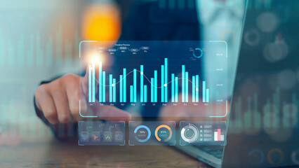 Data analyst working on business analytics dashboard with charts, metrics, and KPI to analyze...