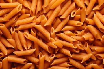 A full-frame shot of a raw Penne pasta background.