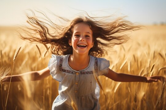 young happy girl running and jumping carefree with open arms over wheat field