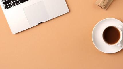 Captivating Overhead Shot of Laptop and Coffee on a Brown Table with Blank Space and Notice Paper - Perfect Work Environment with a Cup of Joe