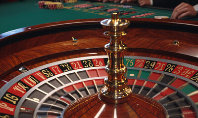 close up of bright multicolored casino roulette table with poker chips