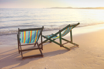 Two sun chairs on the beach