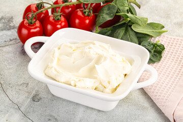 Soft cream cheese in the bowl