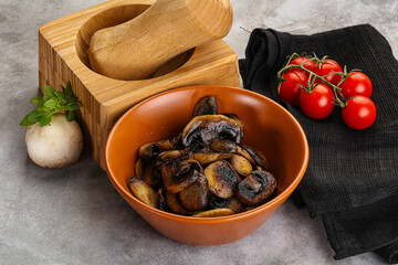 Roasted champignon mushrooms in the bowl
