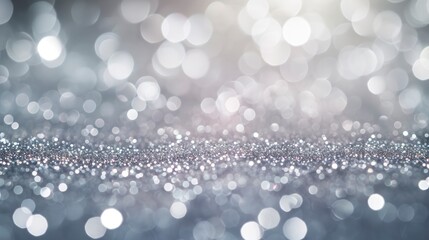 An Abstract Background of Vintage Lights in Silver and White, De-focused to Create a Shimmering Banner of Timeless Glamour.