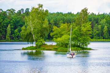 Fototapeta na wymiar Yacht on lake in Tuchola Forests, Poland.