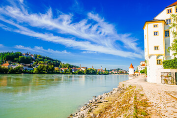 View of the Inn River and the Schaiblingsturm in Passau. Historic round tower of the city with the...