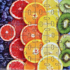 A lifelike image of a jigsaw puzzle featuring slices of various fruits