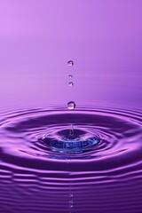 drop of water in purple background 
