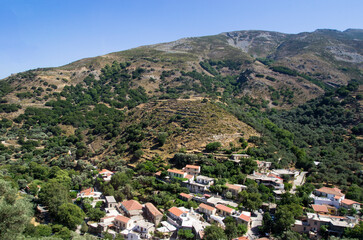 Fototapeta na wymiar Greek village on the mountainside, landscape