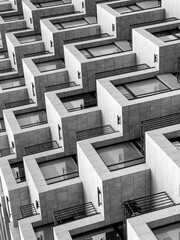 Geometric pattern of apartment balconies in monochrome. Abstract urban architecture.