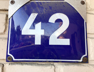 Blue numberplate that says number 42