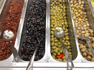 Different types of olives fo sale in a store