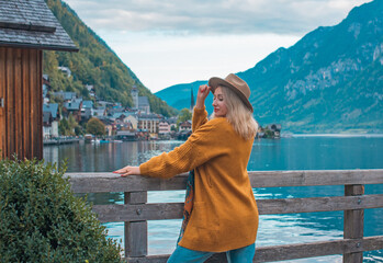 Vacation in Austria. Concept of tourism and holidays. Woman resting in Hallstatt, nature scene