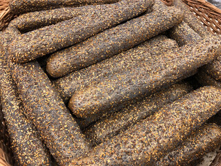 Long brown baguettes at the bakery