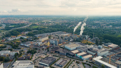 Ghent, Belgium. Factory with chimneys and clouds of smoke in the suburbs of Ghent. River Esco (Scheldt), Aerial View