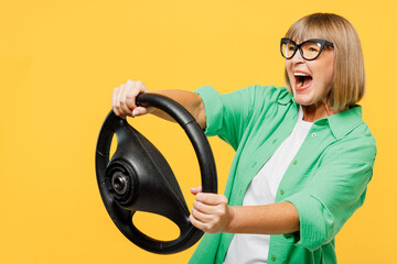 Side view surprised shocked elderly blonde woman 50s years old wears green shirt glasses casual...