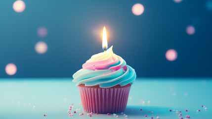 Birthday cupcake with burning candle on blue bokeh background,  Birthday greeting card.