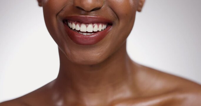 Black woman, teeth and smile for dental hygiene, skincare or cosmetics on a gray studio background. Closeup of African female person mouth for dentist, tooth whitening or oral and gum care treatment