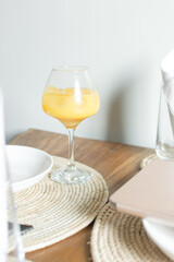 Mimosa cocktails in a wine glass, Orange juice with ice in a wine glass, orange cocktail in a stemmed wine glass