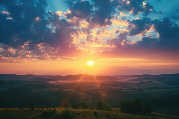 Stylized photo of a sunrise seen from a high vantage point over a rolling countryside - obrazy, fototapety, plakaty