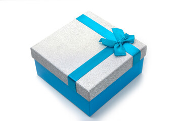 Beautiful blue gift box with a bow isolated on white. Surprise, gift, attention.