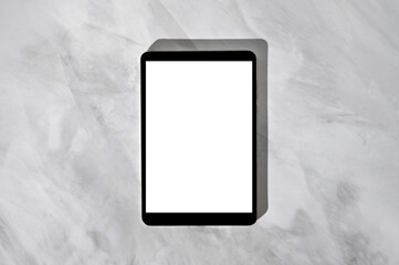 Tablet with blank white screen mockup on neutral gray marble desk background, with soft natural light shadows. Minimal business brand template for website, online store, social media blog design