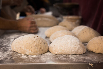 Fototapeta na wymiar Bread preparation. loaves of dough before baking