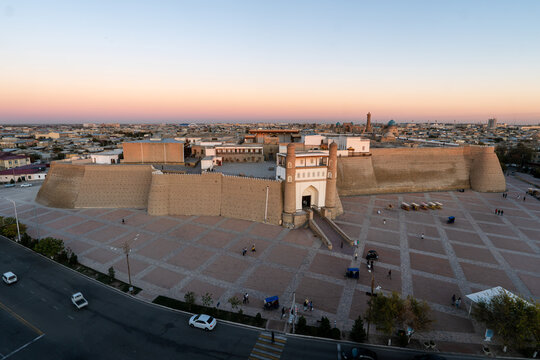 Panorama of the historical center of Bukhara, Uzbekistan. Foreground: ancient fortress Ark and Khan palace. Background: minarets and domes of historical buildings