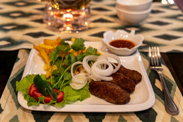 lula french fries salad side view on table in a restaurant close-up