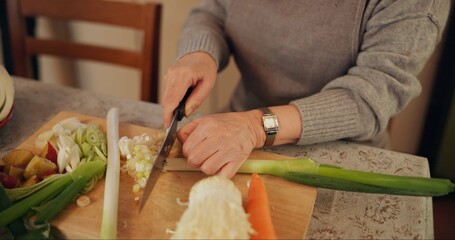 Cooking, vegetables and closeup of woman in kitchen cutting ingredients for meal, dinner or lunch....