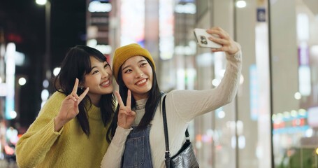 Friends, Japanese and selfie with women, happy and excited with adventure, profile picture and social media. People, smartphone or girls with night, fun and bonding together with pose and peace sign