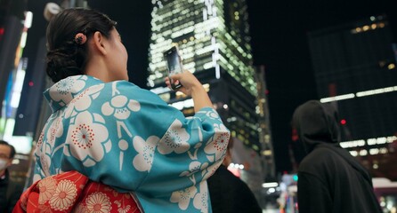 Japanese woman, picture and night with smartphone, social media and connection with network,...