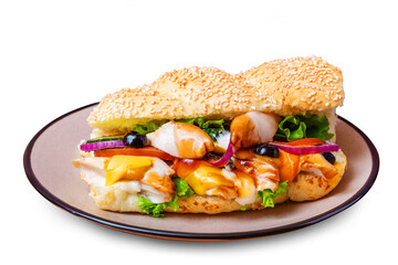 Sandwich with chicken fillet, onion, cheese, cucumber, olives and lettuce. Isolated.