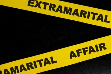 Extramarital affair crime scene, caution and warning concept. Yellow barricade tape with word in dark black background.