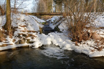 Output of the mill drive in winter. River Juhyne. Komarno. Eastern Moravia. Czechia.