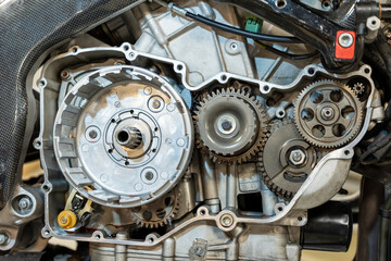 Vibrant snapshots capture the skilled artistry at a motorcycle repair workshop—mechanics in...