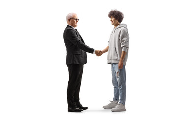 Mature businessman and a generation z guy shaking hand