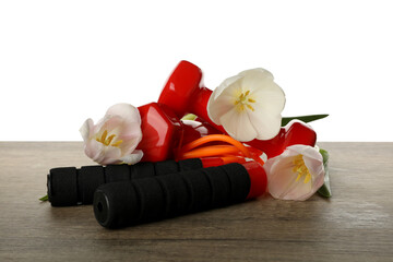PNG sports goods with flowers on table isolated on white background.