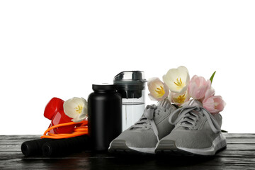 PNG sports goods with flowers on table isolated on white background.