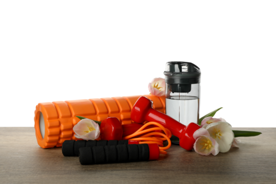 PNG sports goods with flowers on table isolated on white background.