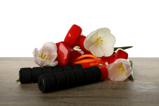 PNG sports goods with flowers on table isolated on white background.