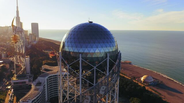 Aerial view of Batumi city panorama downtown at sunset. Flying on drone above old town roofs. Famous international Georgian black sea resort.