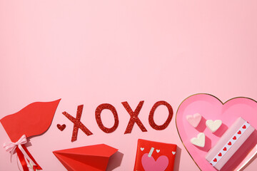 Flat lay plate in the shape of a heart on a pink background.