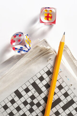 Newspaper, pencil and dice