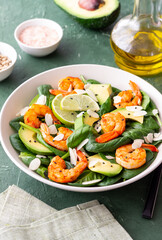 Salad with shrimps, avocado, spinach and almonds. Healthy eating. Diet.