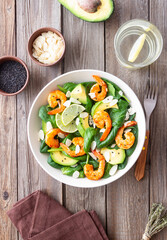 Salad with shrimps, avocado, spinach and almonds. Healthy eating. Diet.